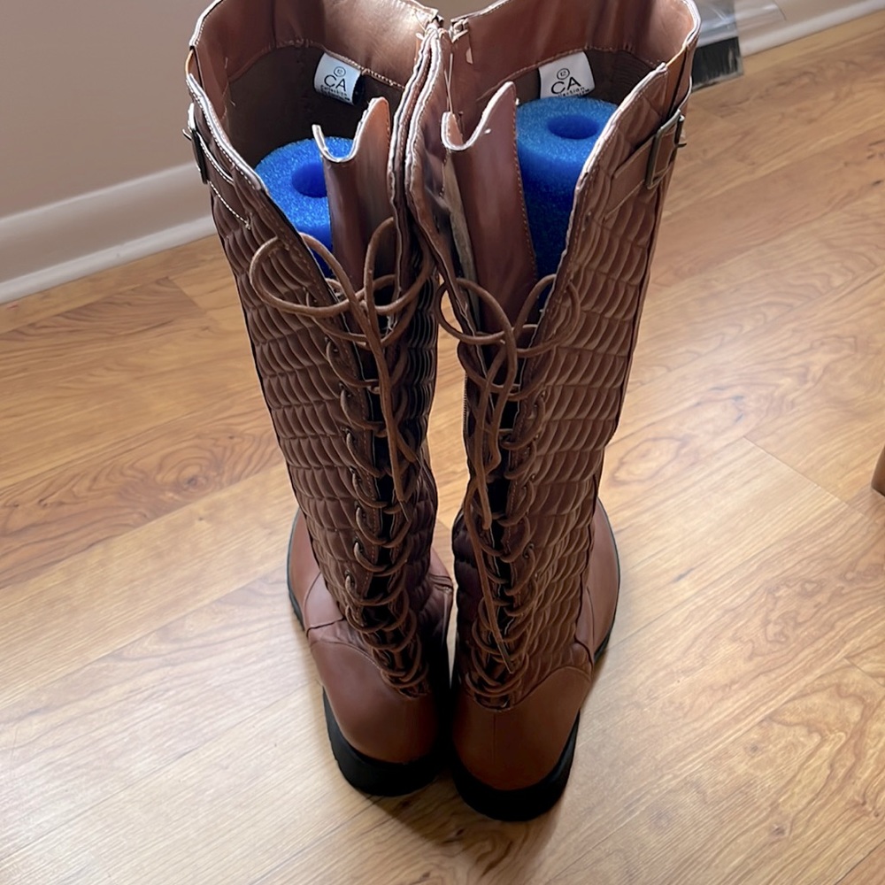 Knee high lace up back boots